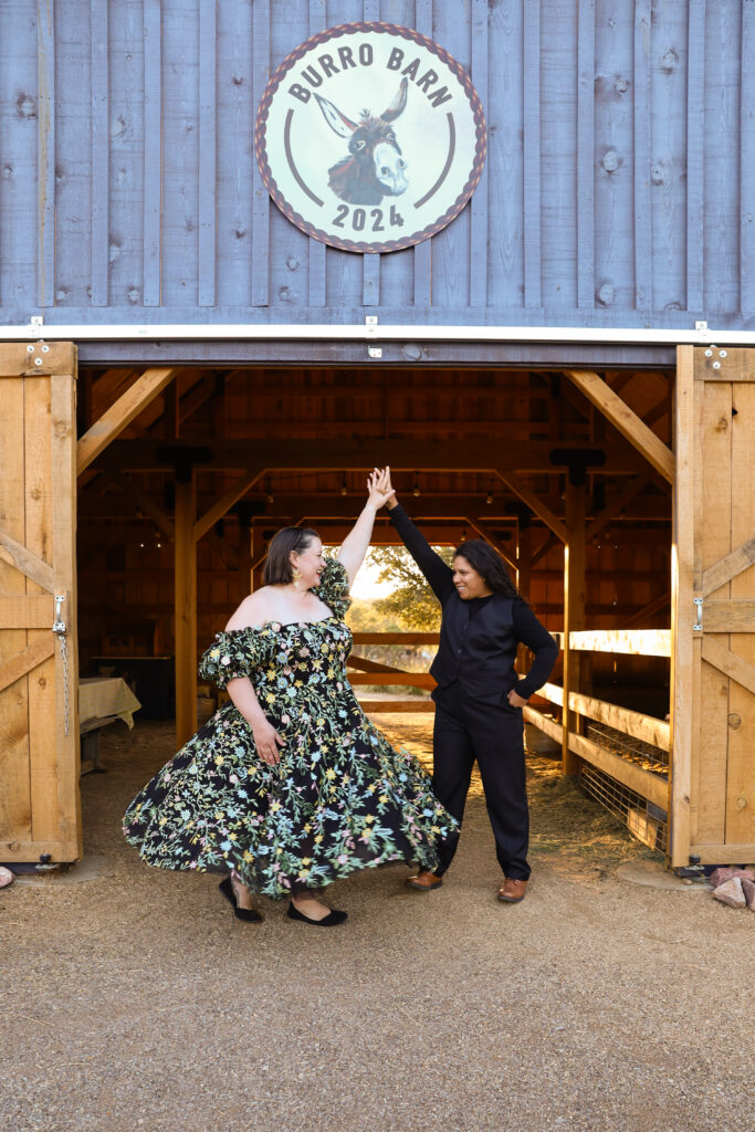 Couple twirling in a barn at a lavender farm.